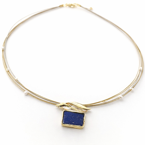 Gold bracelet with a blue square stone on a white background