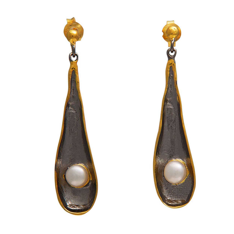 Pair of earrings with gold and black design on a white background