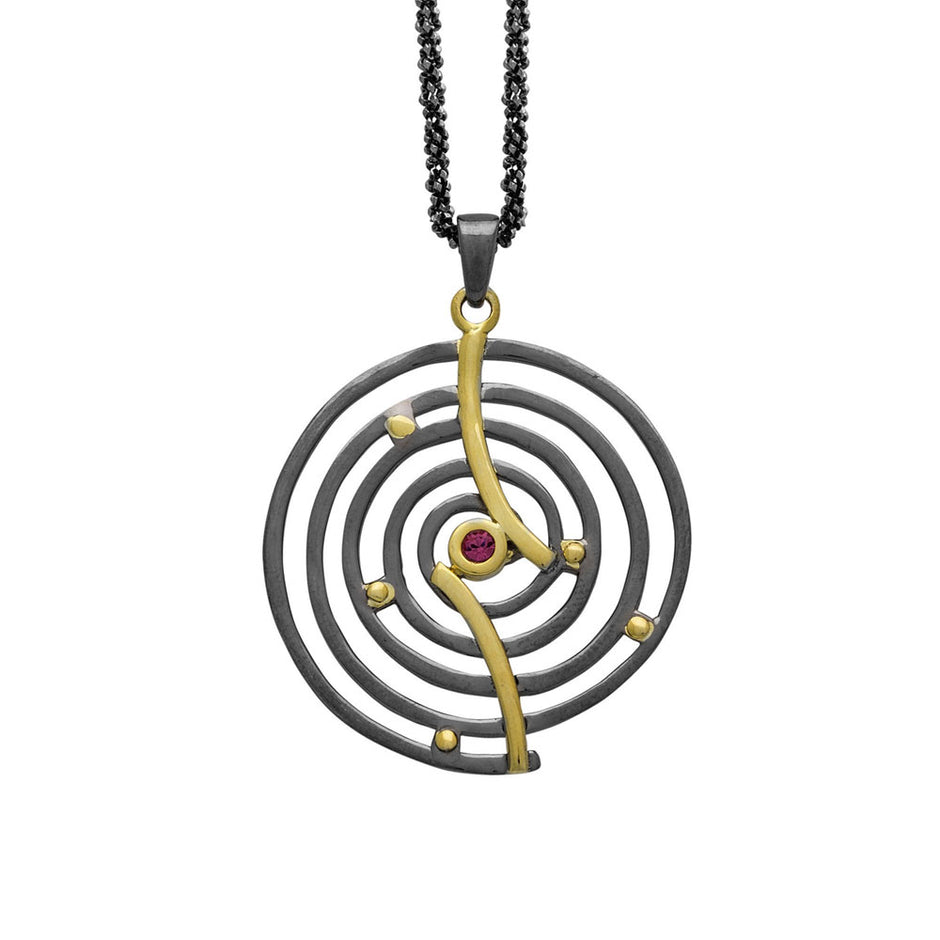 ENOTIA handmade spiral necklace in 925 silver with black rhodium, gold-plated accents, and red garnet