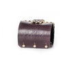 Back view of THE DARK Atelier deep-plum leather cuff showing its leather finish