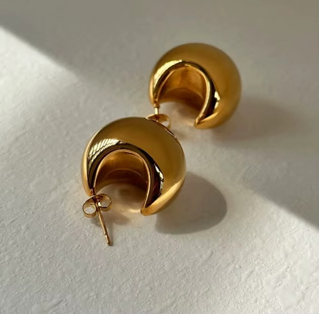 Gold-tone stainless steel crescent sculptural stud earrings with polished finish
