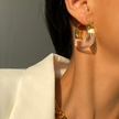 Gold-Plated Earrings with Sculptural Resin Curve