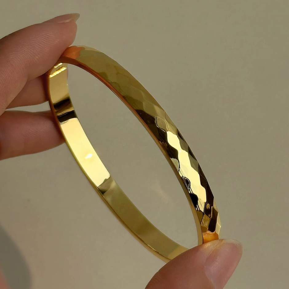 ENOTIA faceted gold-plated stainless steel bangle – high shine finish