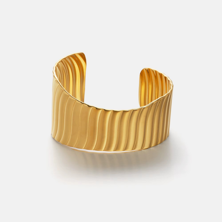 “ENOTIA wave textured gold-plated stainless steel cuff bracelet – wide design”