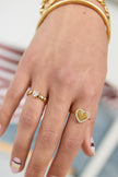 Ring with alternating hearts and cubic zirconia