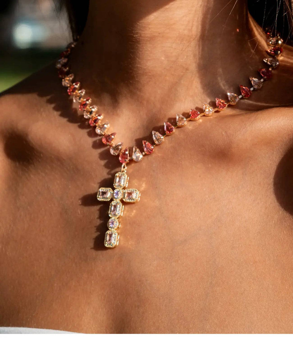 Necklace with a cross pendant on a person's neck