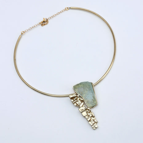 “Handmade bronze necklace with aqua resin sculptural pendant”