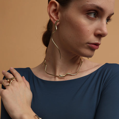 Handmade bronze snaky earrings with organic curved design made in Greece