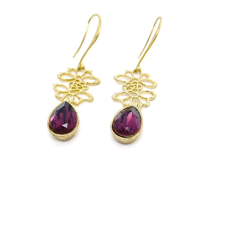 “Handmade brass floral cutout earrings with purple crystal”